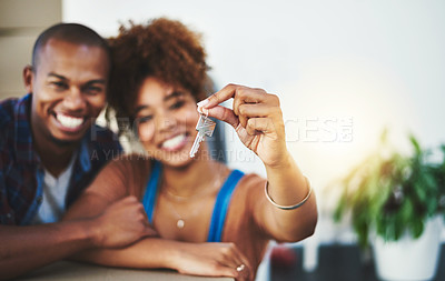 Buy stock photo Shot of an attractive young couple moving house