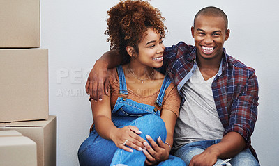 Buy stock photo Shot of an attractive young couple moving house