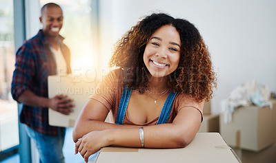 Buy stock photo Shot of an attractive young couple moving house