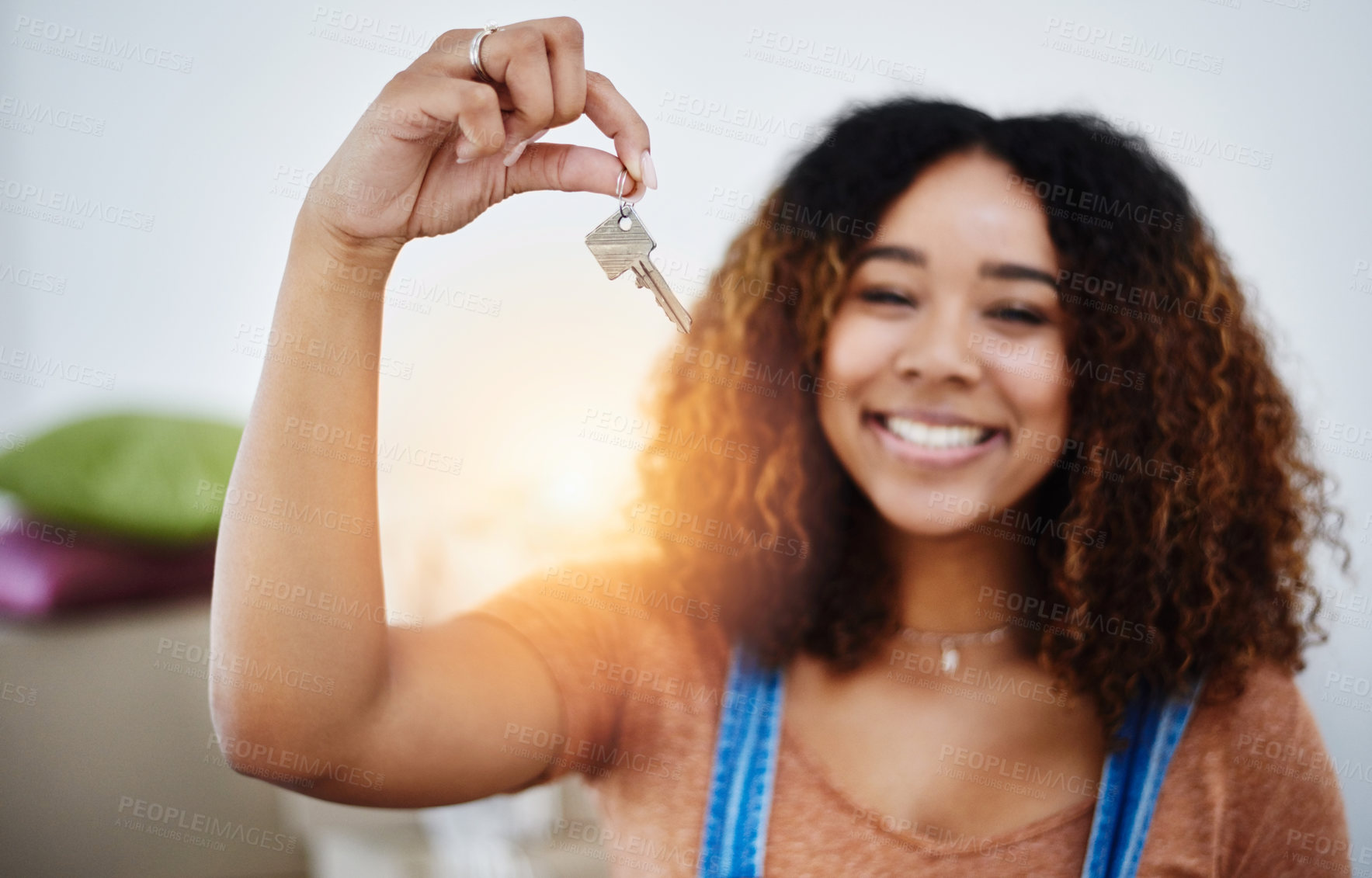 Buy stock photo Cropped shot of a beautiful young woman holding house keys in her new home