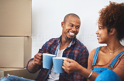 Buy stock photo Couple, boxes and celebration on apartment floor with smile in for moving, investment and rental property. People, cheers and happy in living room with package for logistics, new house or real estate