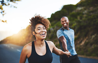Buy stock photo Cropped shot of a happy young couple out for a run together