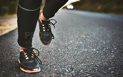 Buy stock photo Cropped shot of an unrecognizable woman wearing comfortable running shoes