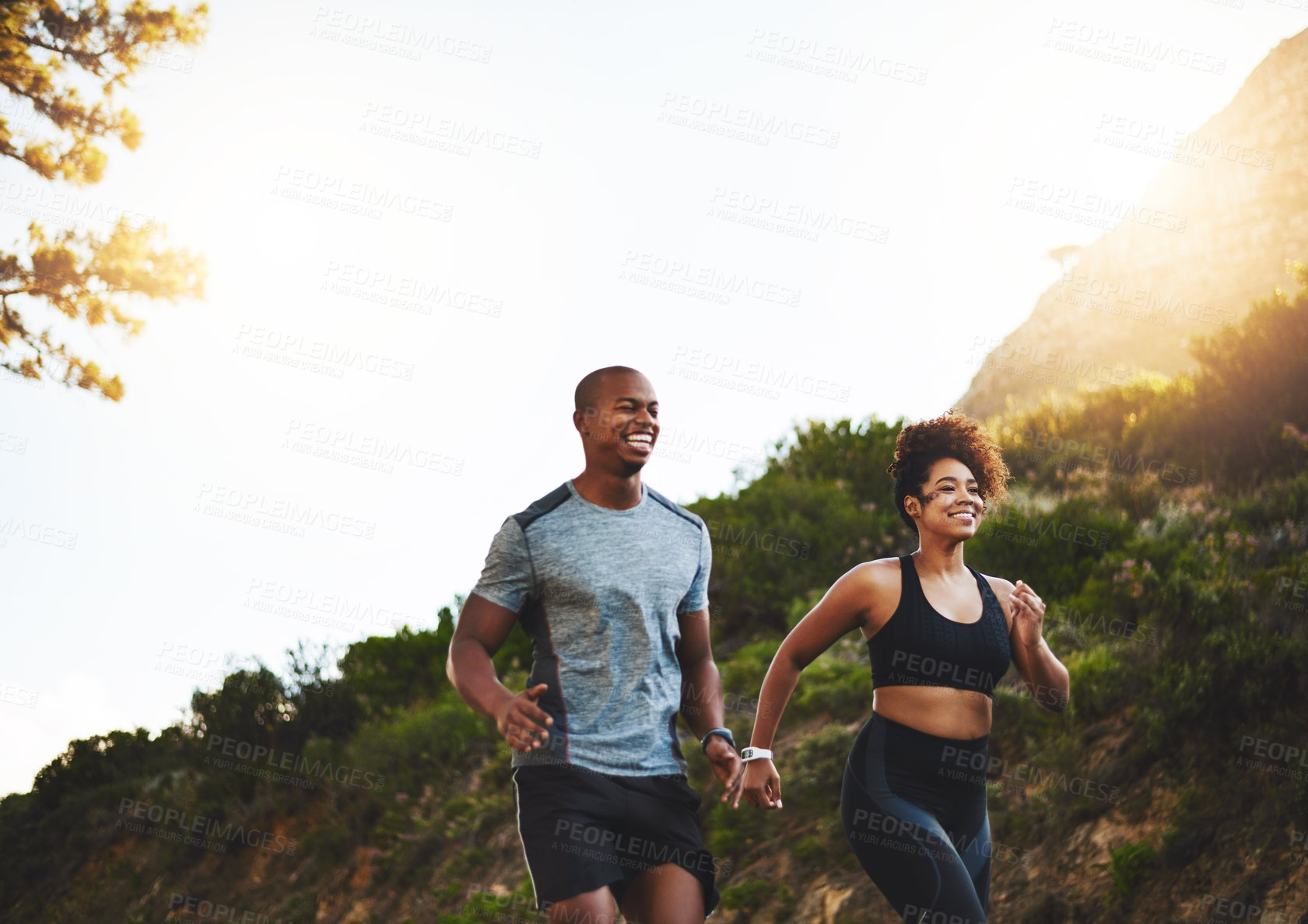 Buy stock photo Cropped shot of a happy young couple out for a run together