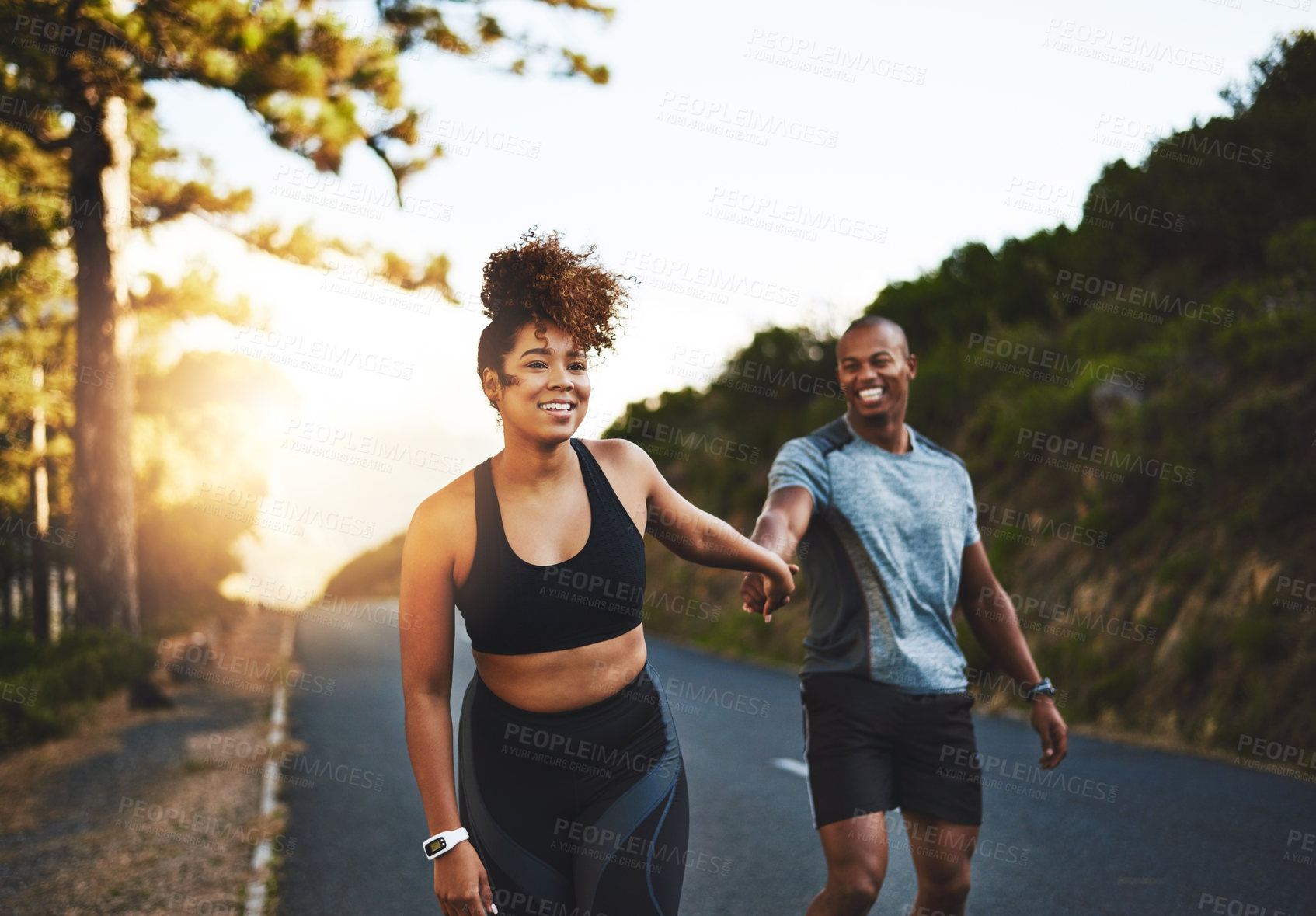 Buy stock photo Holding hands, man and woman on mountain for running, exercise and fitness for wellness. Sunshine, couple and happy in nature for health, support and performance for marathon training in morning