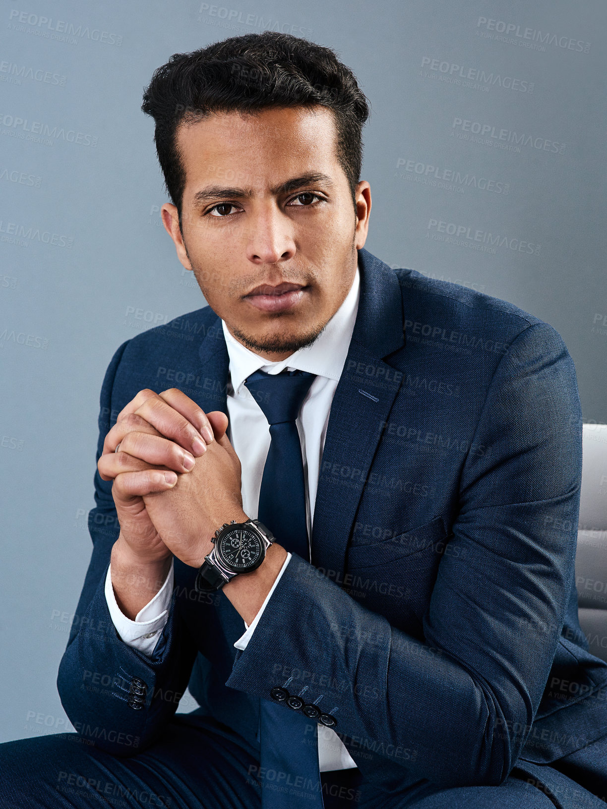 Buy stock photo Studio shot of a corporate businessman posing against a grey background