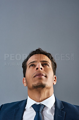 Buy stock photo Studio shot of a corporate businessman posing against a grey background