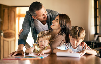 Buy stock photo Family, education and homework with kids, drawing and notepad with parents teaching for learning. Children, home school or study with siblings, mother and father in kitchen for growth or development