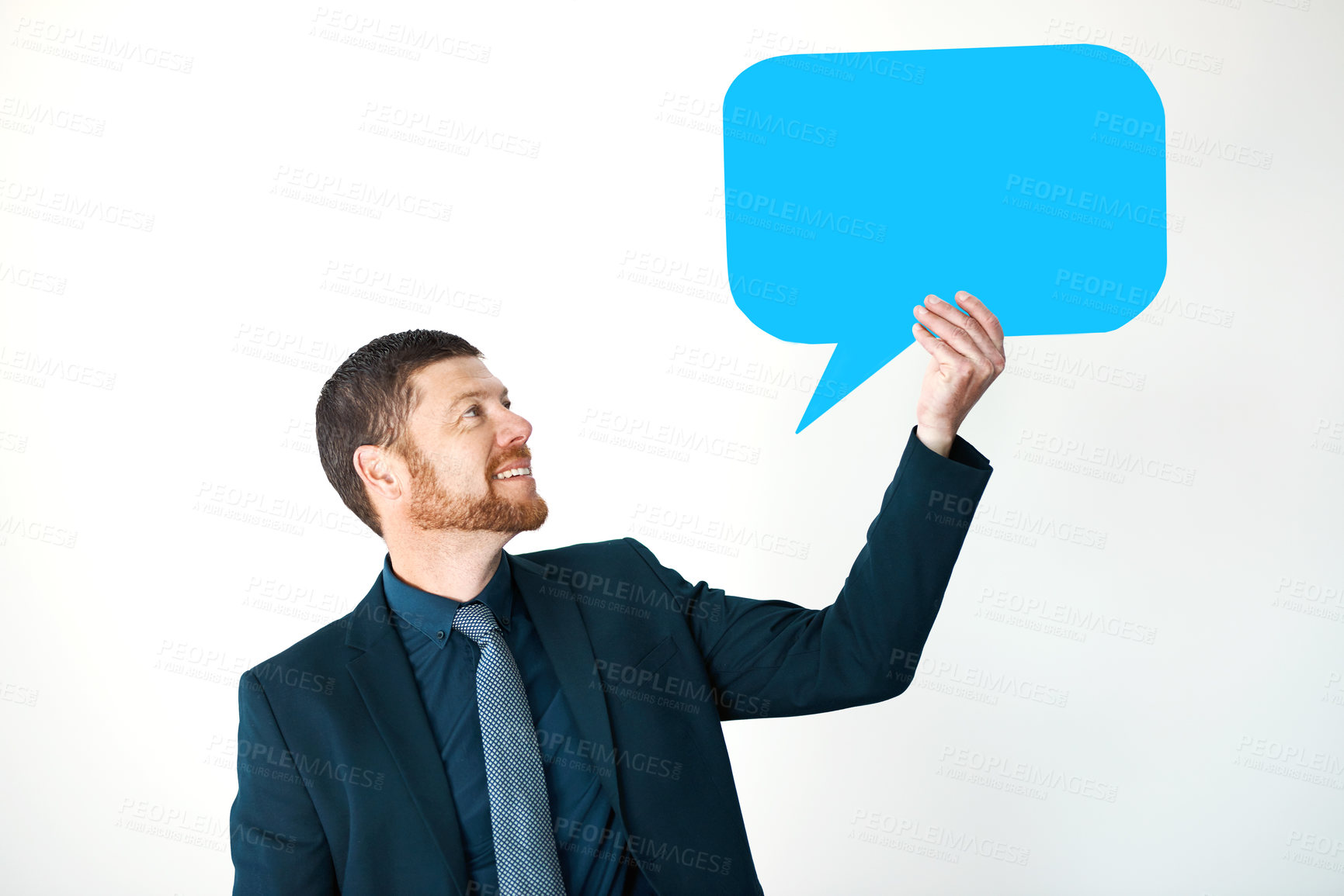 Buy stock photo Cropped shot of a handsome mature businessman holding up a speech bubble