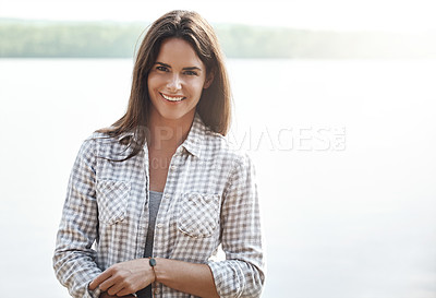 Buy stock photo Portrait of an attractive young woman relaxing at the lake