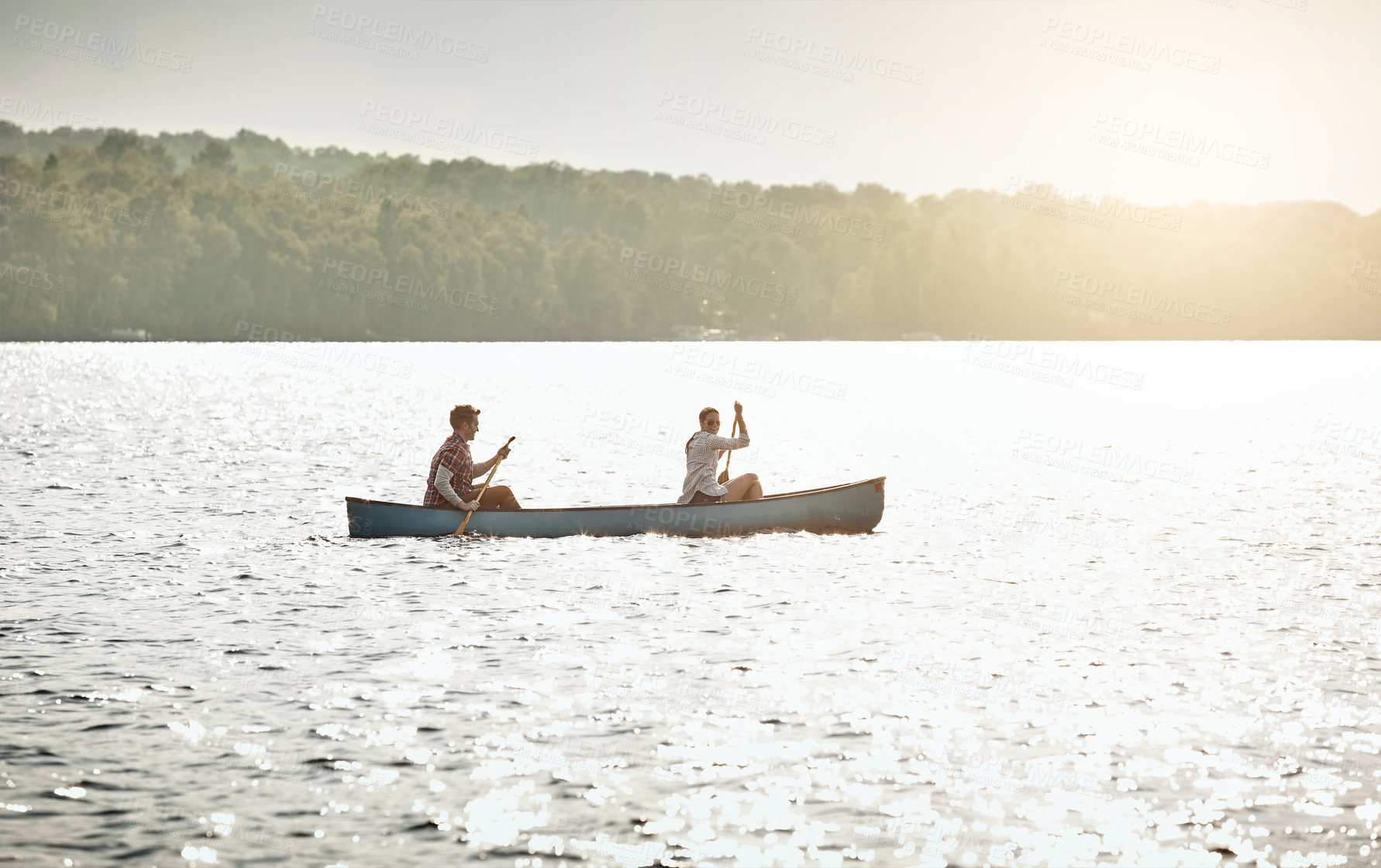 Buy stock photo Boat, rowing and couple on lake for travel, vacation or weekend trip with summer adventure. Hobby, bonding and people kayaking or canoeing together on river for holiday activity in Norway nature.