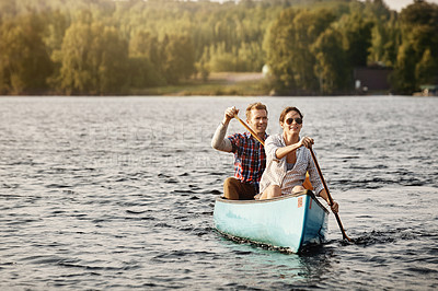 Buy stock photo Couple, kayak and rowing on lake for holiday, travel and adventure for activity on river. Paddle, water sports and vacation in Germany, sunshine and nature for married people on boat for fitness