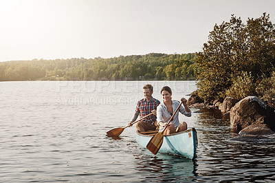 Buy stock photo Couple, kayak and paddle on lake for holiday, forest and adventure for activity on river. Rowing, water sports and vacation in Canada, sunshine and nature for married people on boat for fitness