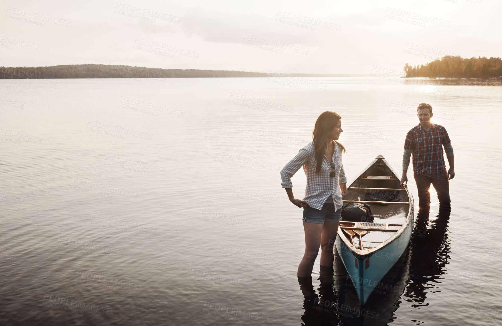 Buy stock photo Thinking, woman and man with boat by lake for adventure, summer and sunset in nature. Couple, peace and happiness for travel, journey and freedom or support for canoe and wellness by river or water 