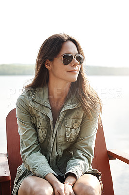 Buy stock photo Thinking, lake and woman relax in nature on deck chair for peace and calm on holiday outdoor. Vacation, travel and person by water for dream, remember memory and tourist with view of river in Spain