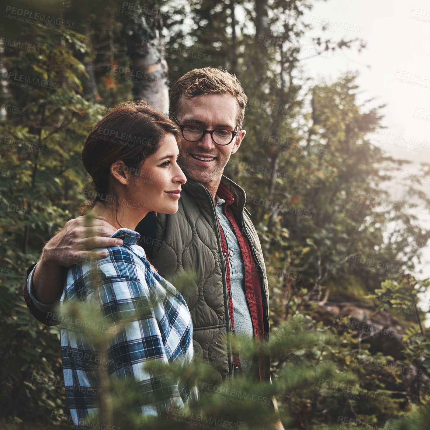 Buy stock photo Shot of a young couple exploring nature together