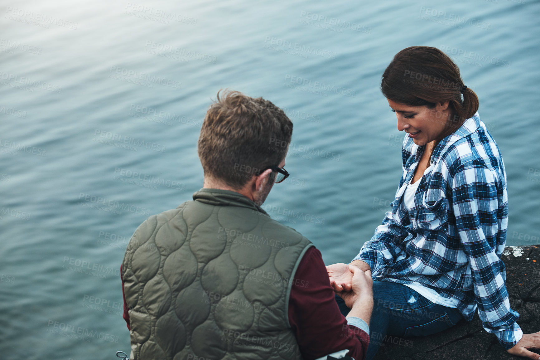 Buy stock photo Shot of a loving couple taking a break while out exploring nature