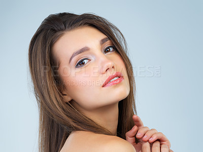 Buy stock photo Cosmetics, beauty and portrait of woman with makeup on blue background for wellness, skincare and spa treatment. Salon aesthetic, dermatology and face of girl with cosmetics, confidence and facial