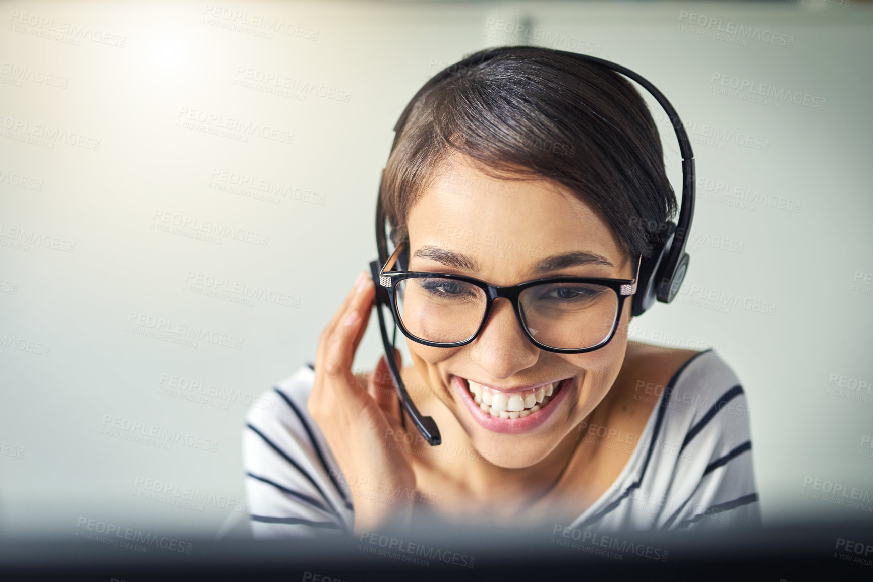 Buy stock photo Cropped shot of a young attractive female customer support agent working in the office