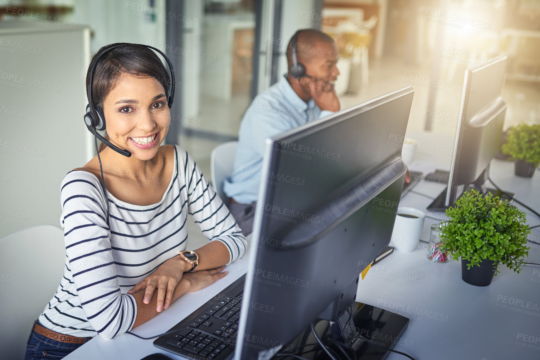 Buy stock photo Cropped shot of a young attractive female customer support agent working in the office