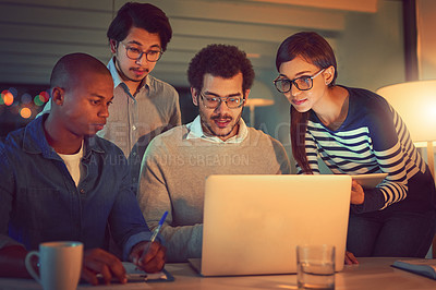 Buy stock photo Shot of a group of designers working late in an office