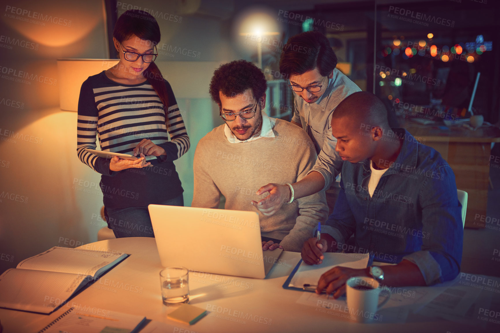 Buy stock photo Shot of a group of designers working late in an office