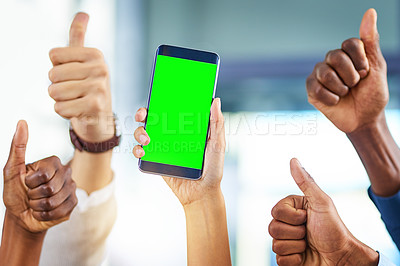 Buy stock photo Cropped shot of a group of businesspeople giving thumbs up and holding a mobile phone in a modern office