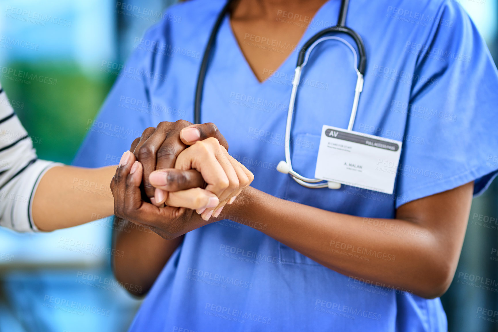 Buy stock photo Closeup shot of a medical practitioner holding a patient's hand in comfort