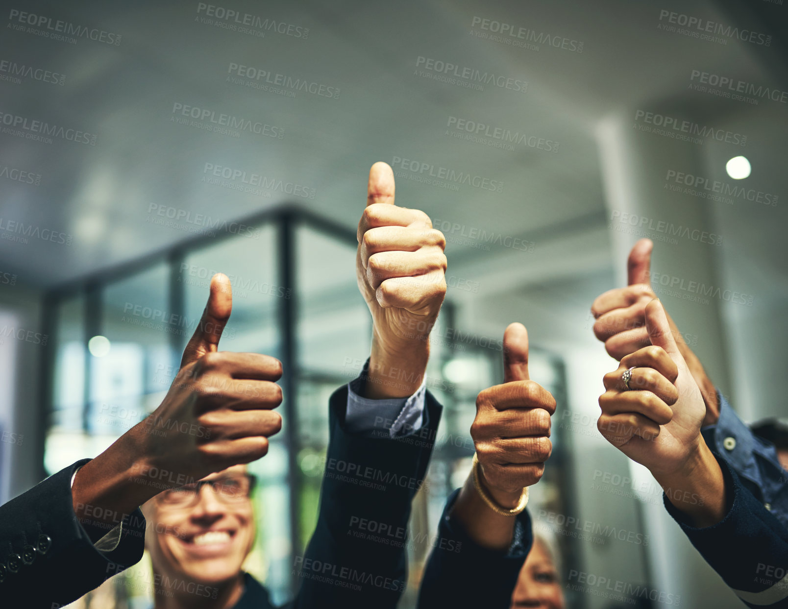 Buy stock photo Closeup shot of a group of unrecognizable businesspeople showing thumbs up in an office