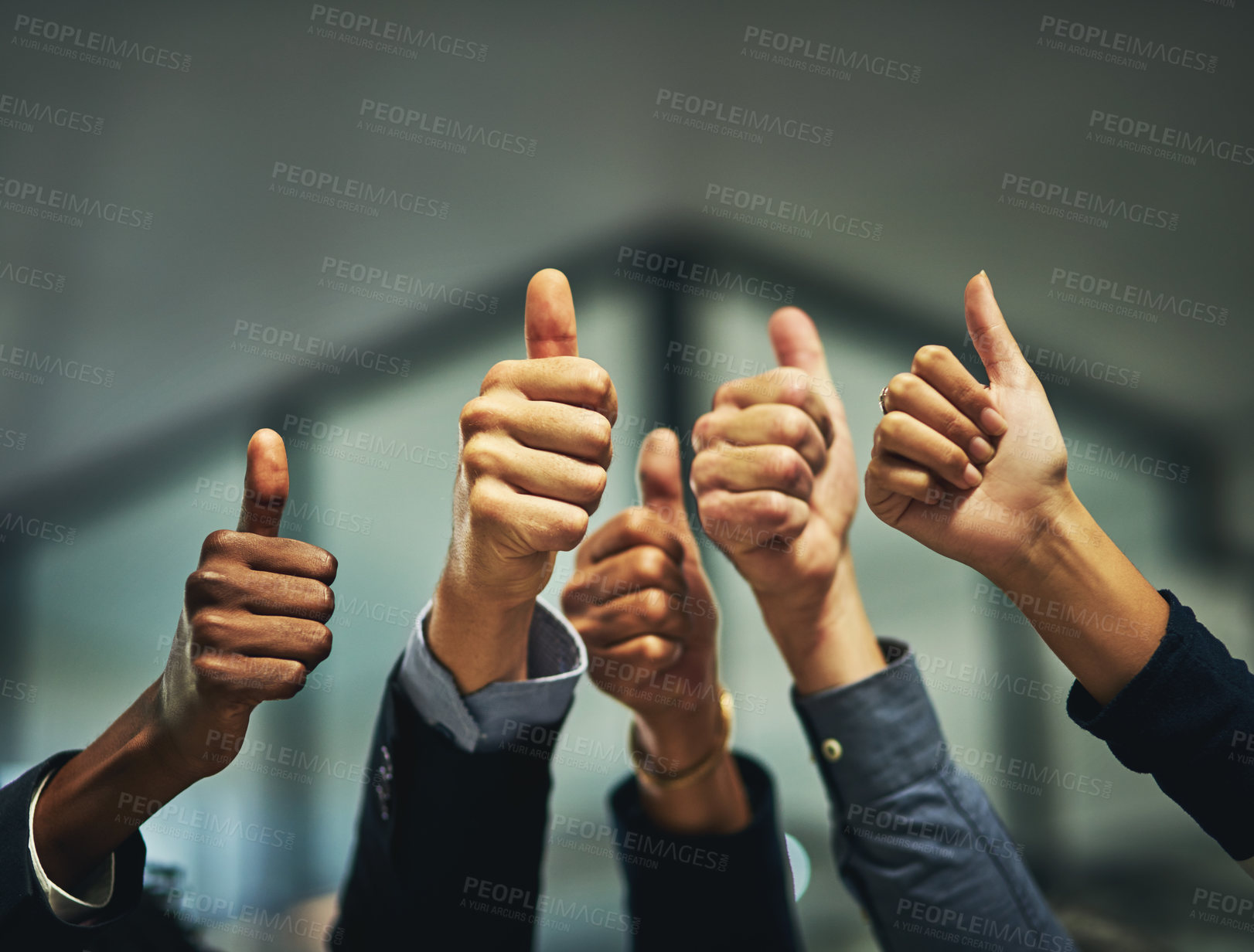 Buy stock photo Closeup shot of a group of unrecognizable businesspeople showing thumbs up in an office