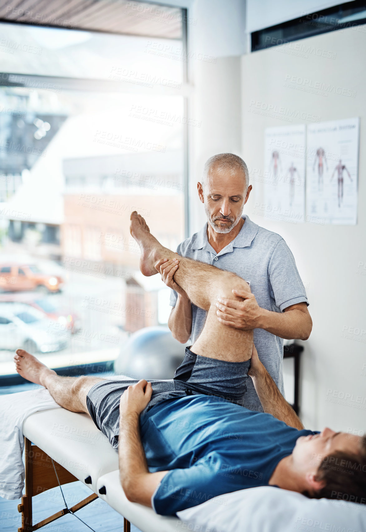 Buy stock photo Shot of a physiotherapist treating a patient