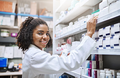 Buy stock photo Cropped portrait of an attractive young female pharmacist working in a pharmacy