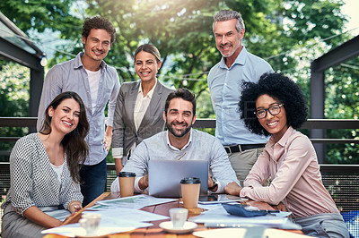 Buy stock photo Cropped portrait of a group of business colleagues having a meeting outdoors at a cafe