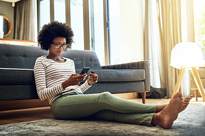 Buy stock photo Black woman, phone and credit card in living room for ecommerce, payment or purchase at home. African female person or shopper sitting on floor with smartphone or debit for online shopping or banking