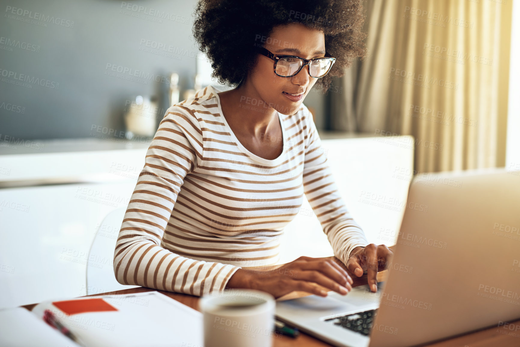 Buy stock photo laptop, typing and African woman in living room with remote work for report, review or freelancer. Online, journalist and person for update article, proofreading or working on feature story in home