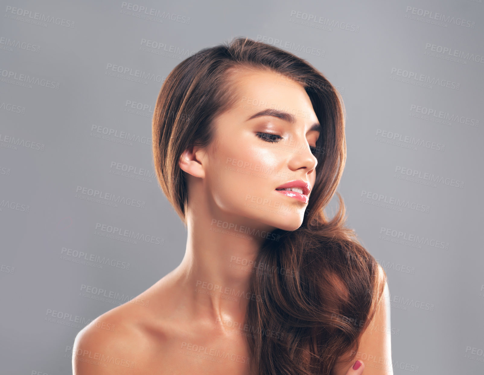 Buy stock photo Shine, hairstyle and face of woman in studio for glow, beauty and hair gloss treatment. Scalp health, salon and growth with person on gray background for haircare cosmetics, volume or keratin