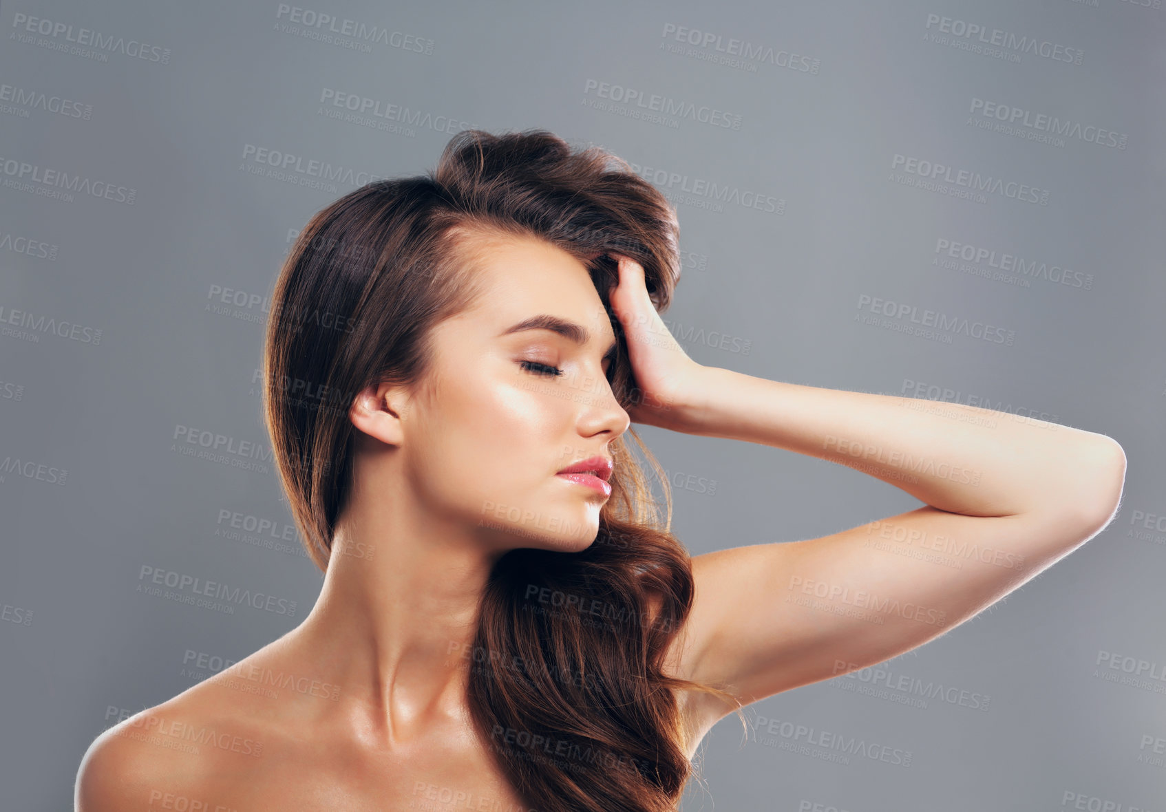 Buy stock photo Shine, hairstyle and profile of woman in studio for glow, beauty and hair gloss treatment. Scalp health, salon and growth with person on gray background for haircare cosmetics, volume or keratin