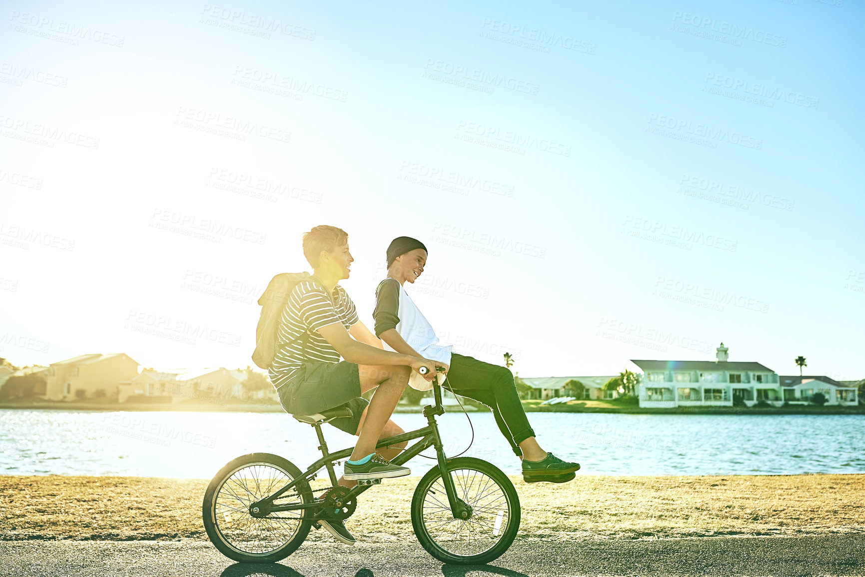Buy stock photo Nature, travel and boys with bicycle for riding, paddle and coordination with balance for brothers. Lagoon, children and siblings with bike for transport, speed and outdoor for bonding together