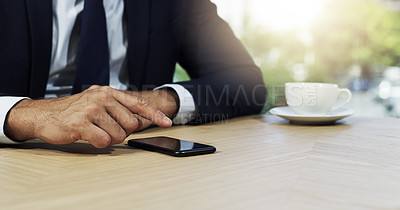 Buy stock photo Closeup shot of an unidentifiable businessman using a cellphone in an office