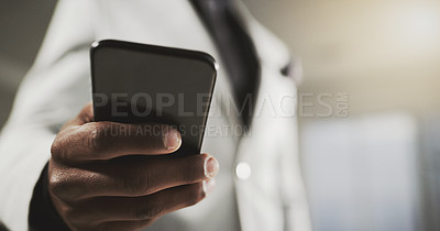Buy stock photo Closeup shot of an unidentifiable businessman using a cellphone in an office