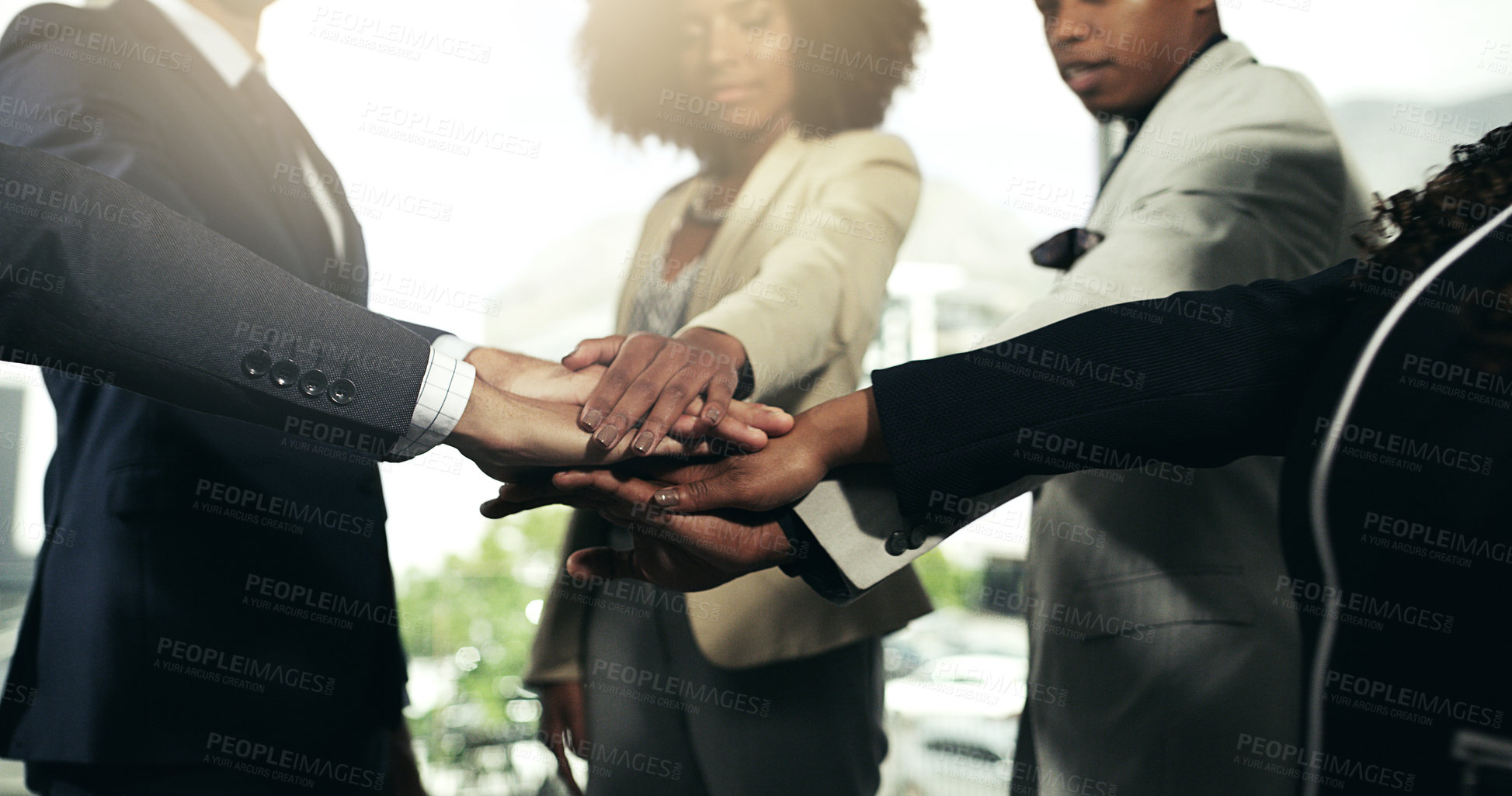 Buy stock photo Closeup shot of a group of unidentifiable businesspeople joining their hands in a huddle