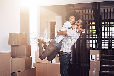 Buy stock photo Moving in, couple hug and love with real estate sale and cardboard boxes at new apartment. Happiness, excited and African woman and man bonding together with a smile from mortgage and property deal