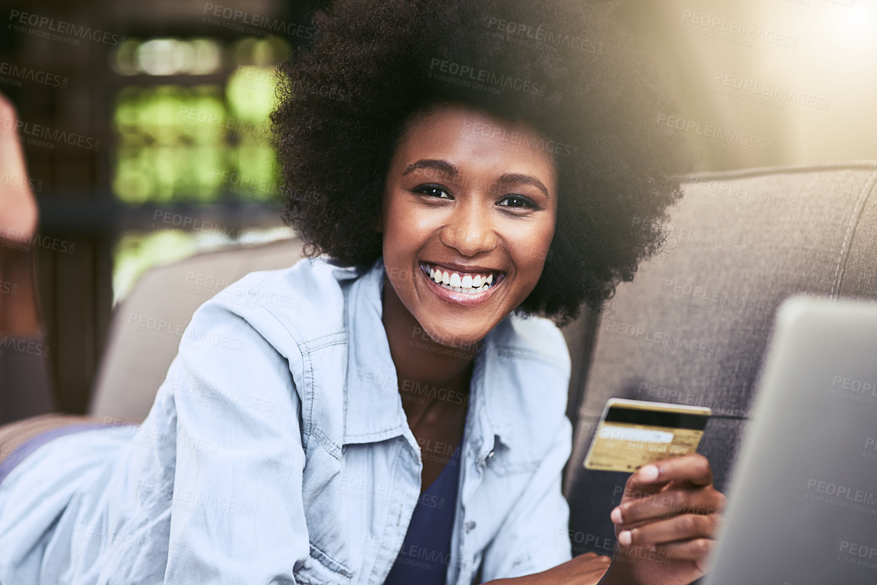 Buy stock photo Black woman, ecommerce and credit card on sofa in house for portrait, relax and online shopping. Female person, laptop and digital payment for internet subscription, membership or fast food discount 
