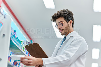 Buy stock photo Pharmacist, clipboard and a man in pharmacy or working in a store for retail career. Male person in pharmaceutical or medical industry for service, healthcare and reading to check inventory on shelf