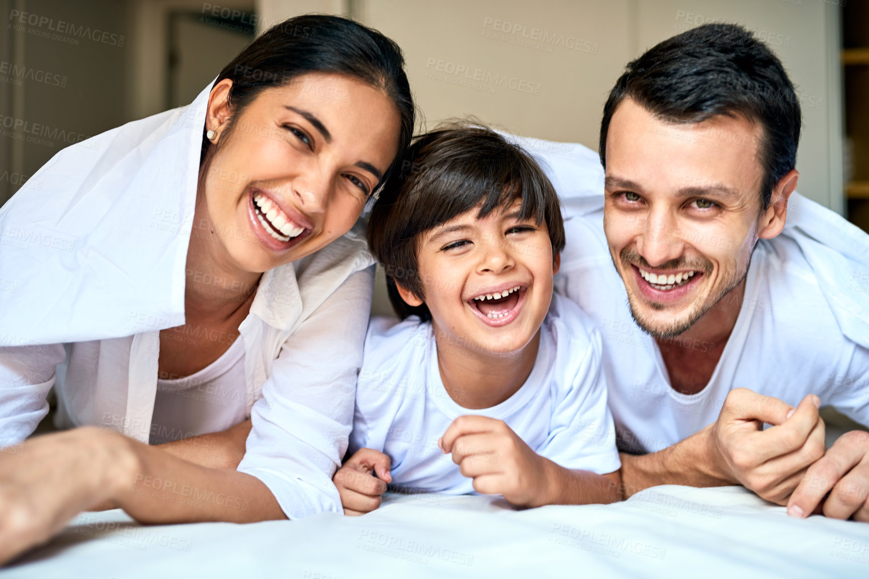Buy stock photo Portrait of a happy family bonding together at home