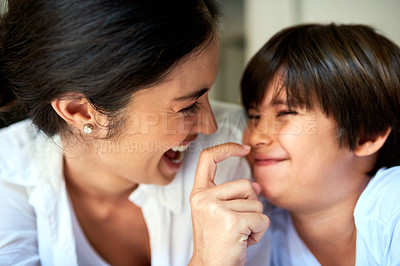 Buy stock photo Shot of a mother and her little son bonding together at home