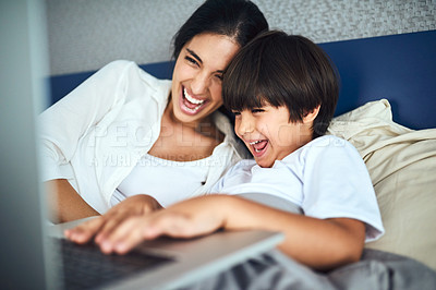 Buy stock photo Shot of a mother and her little son using a laptop together at home