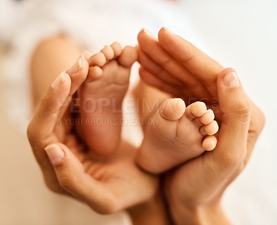 Buy stock photo Baby, feet and mother hands for care, bonding and development with support, love and motherhood in home. Newborn, family and woman for connection, growth and nurture with protection, playing or trust