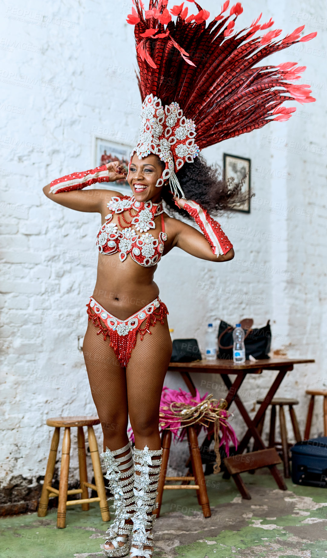 Buy stock photo Cropped shot of a beautiful samba dancer getting ready for a performance during carnival