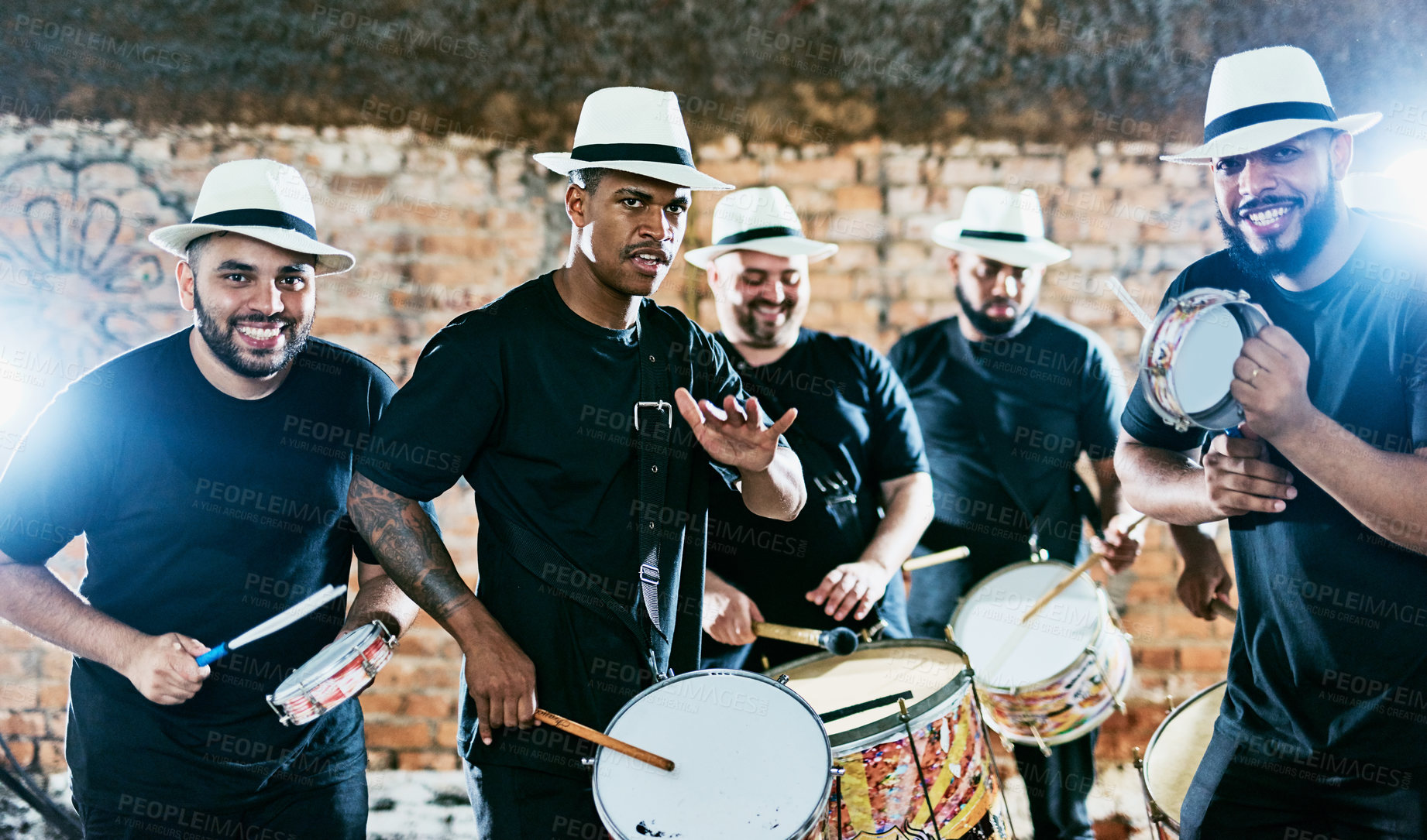 Buy stock photo Cropped shot of a group of men drummers playing music outside